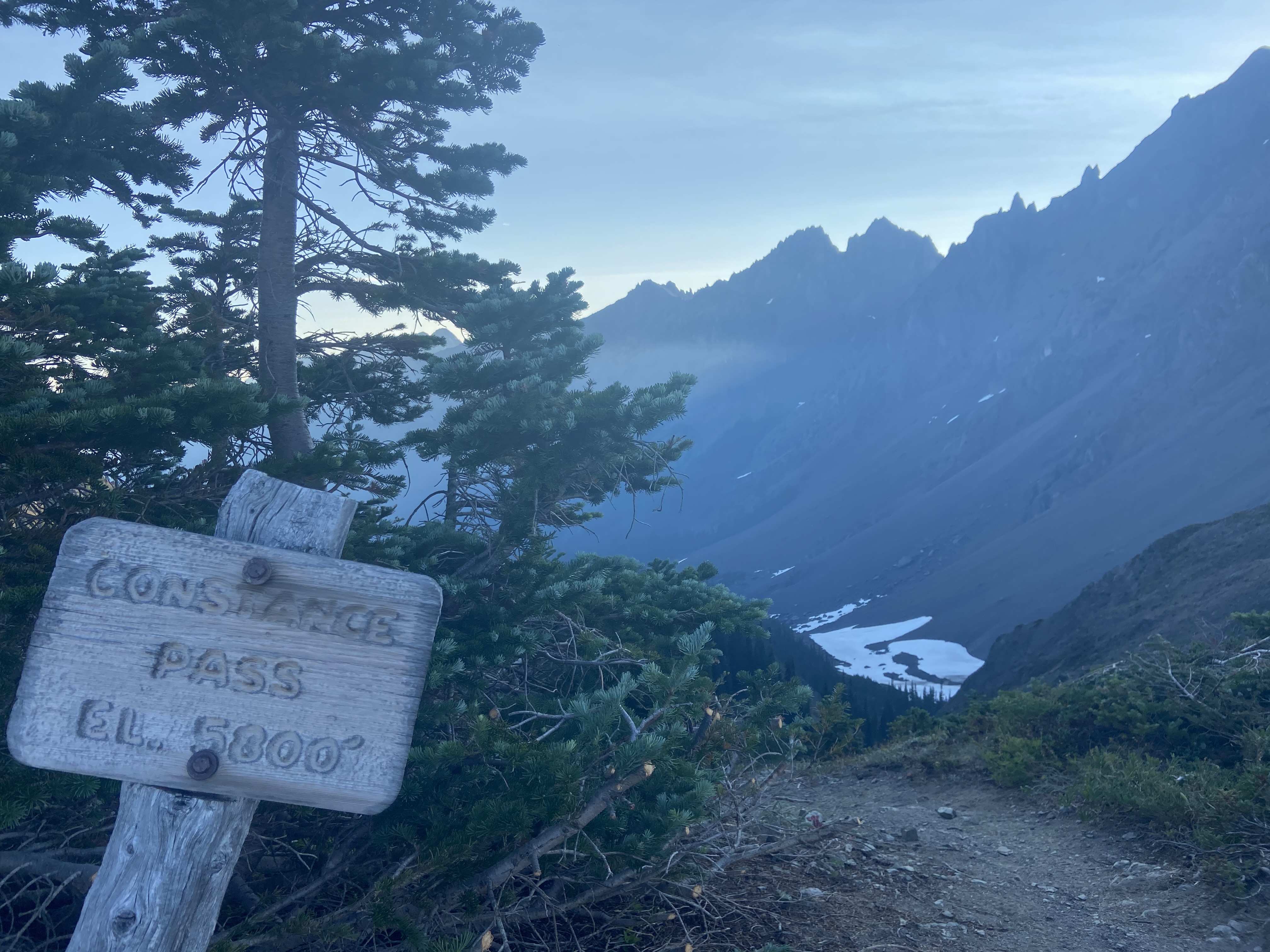 A wooden sign saying "Constance Pass El. 5000ft"