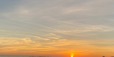 An orange sunset over the ocean.