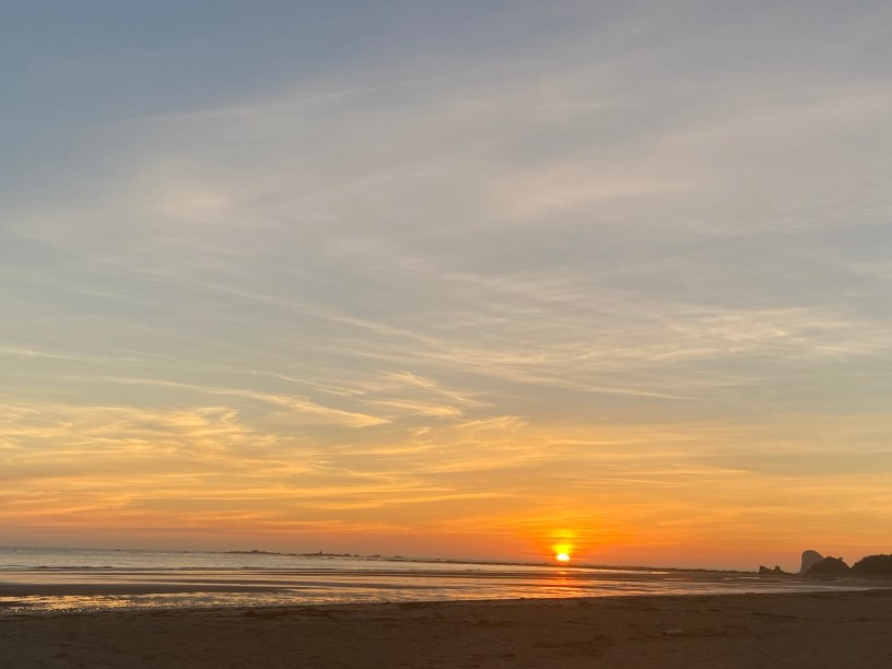 An orange sunset over the ocean.