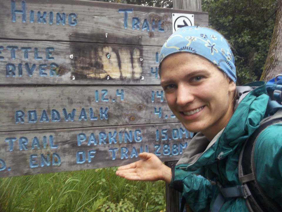 A picture of Anna with an SHT sign that says "End of Trail 28.8 miles."