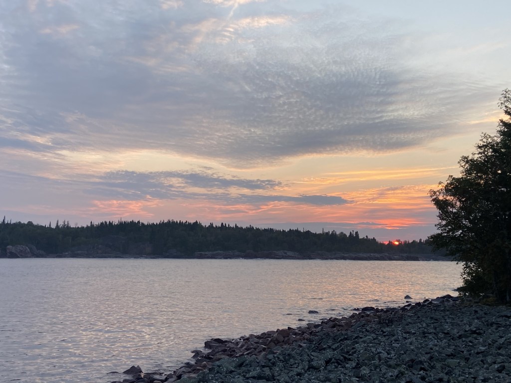 The sun setting over a bay of Lake Superior.